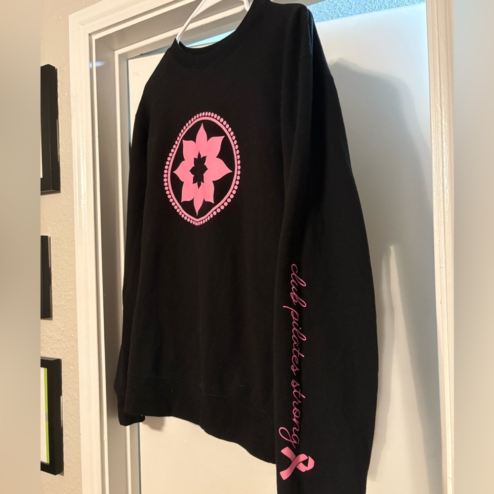 “Club Pilates Strong” black crewneck